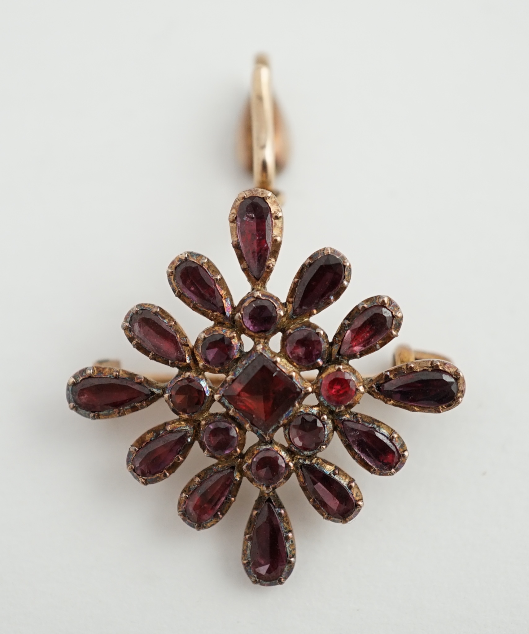 An early Victorian gold and garnet cluster set drop pendant brooch